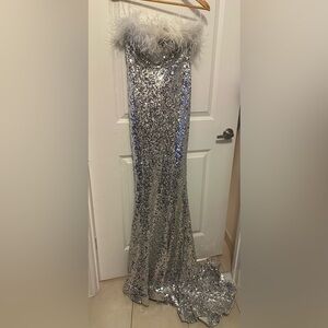 Strapless Silver Sequin stretchy Gown with Feather Trim. Built in padding. NWT